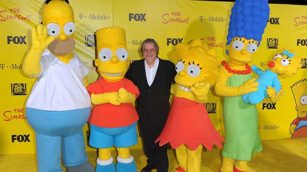 Mattas Groeningas su „Simpsonų“ personažais / AFP/„Scanpix“ nuotr.