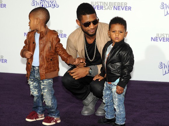 Usheris su savo vaikais / AFP/„Scanpix“ nuotr.