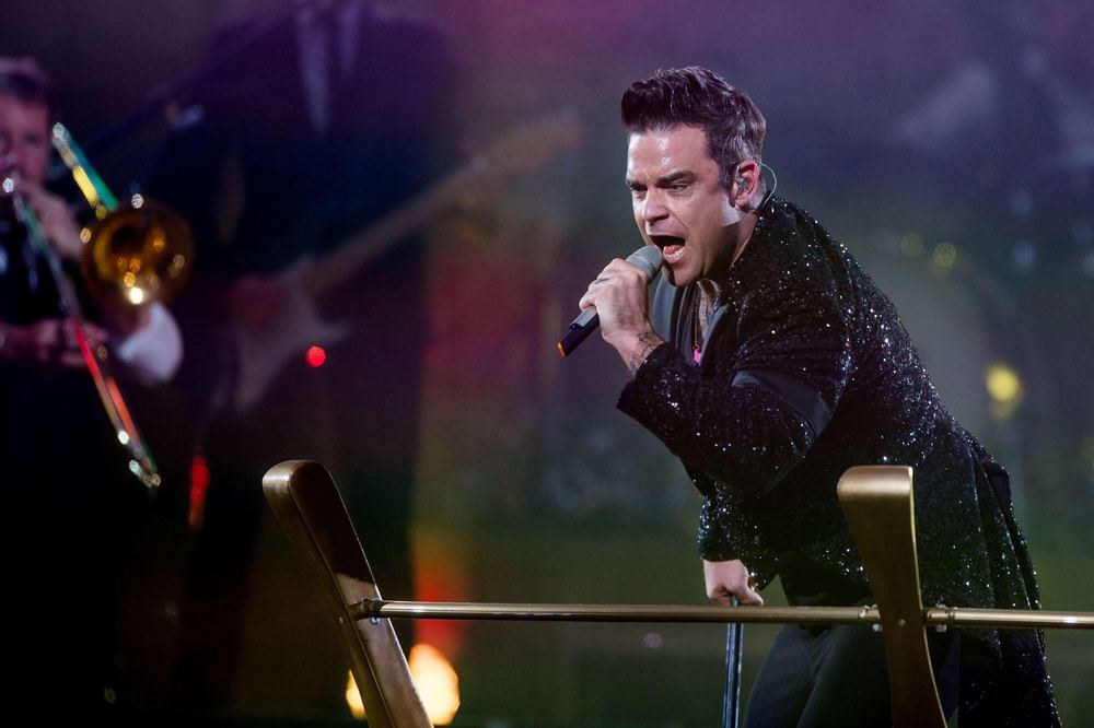 Robbie Williamso koncertinio turo akimirka / „Scanpix“ nuotr.