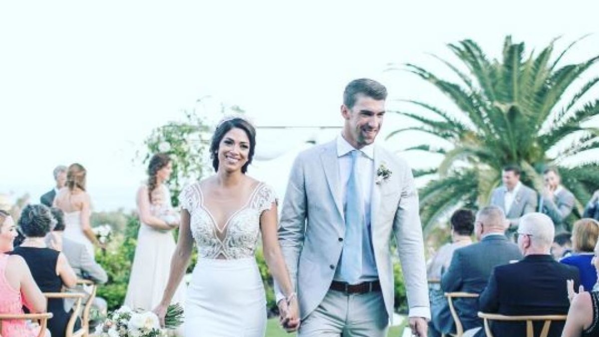 Michaelas Phelpsas su žmona Nicole Johnson  / Instagram nuotr.