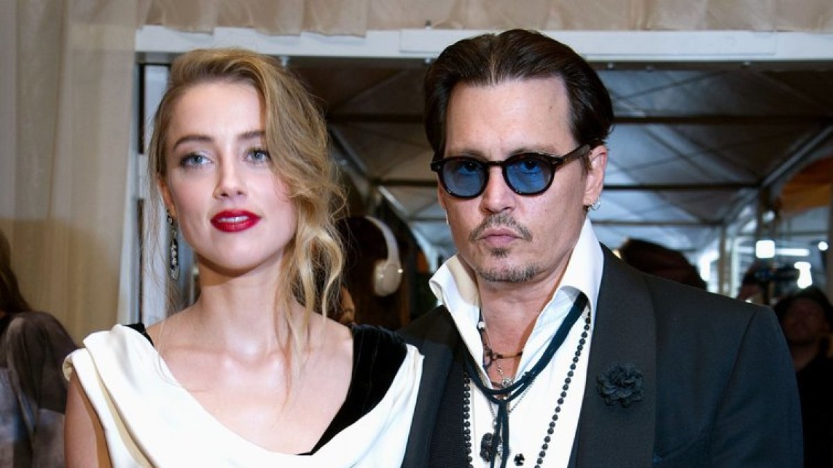 Johnny Deppas ir Amber Heard / AFP/„Scanpix“ nuotr.